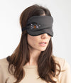 Woman wearing a black EMF protective sleep mask with Leblok logo