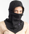 A person wearing a black EMF protective balaclava with the brand name Leblok visible.