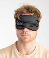 Person wearing Leblok EMF protective sleep mask