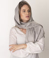 Leblok EMF shielding scarf in grey on womans head