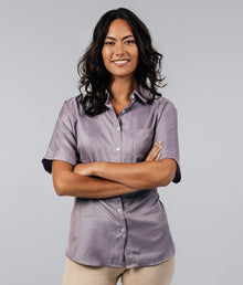  Woman wearing a purple EMF protective short sleeved shirt by Leblok