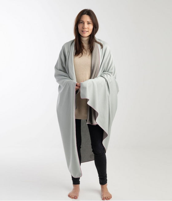 EMF blanket by Leblok in grey on a person