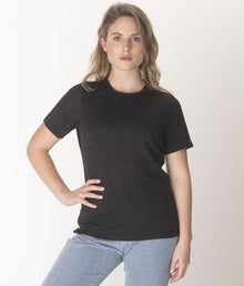  A woman wearing a black crew neck EMF protective Leblok T-shirt and blue jeans