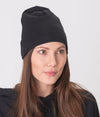 EMF protective beanie Leblok in black displayed on a woman - with matching Leblok hoodie
