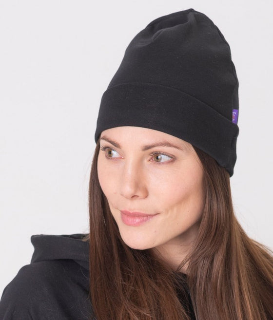 EMF protective beanie Leblok in black displayed on a woman - side view