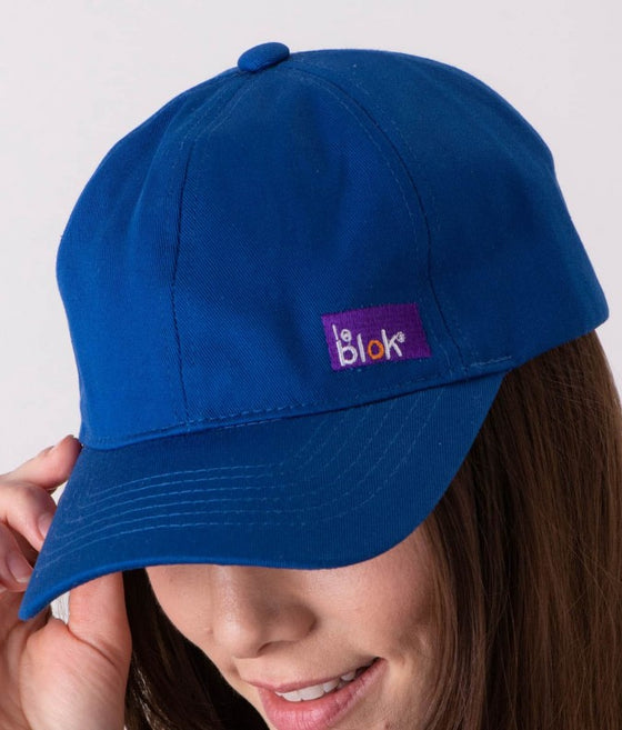 EMF protective Leblok cap in royal blue on a woman