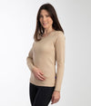 A woman wearing EMF protective Leblok long sleeved vest in beige