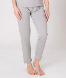  A pair of grey leggings Leblok from EMF protective fabric, displayed on a person