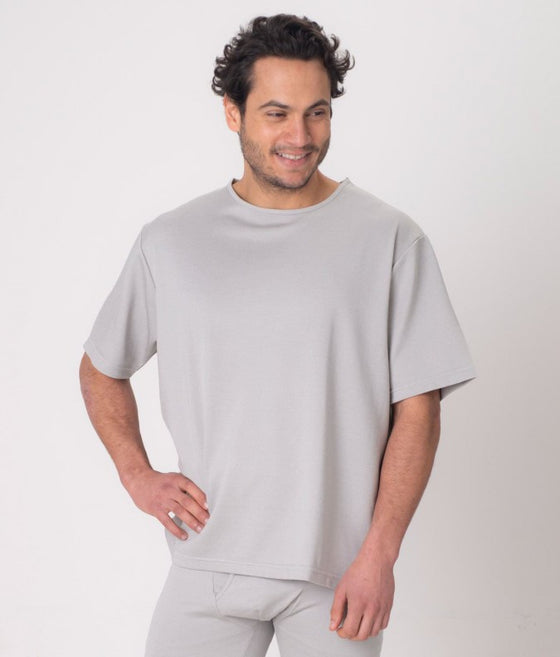 A man wearing a grey EMF protective T-shirt Leblok