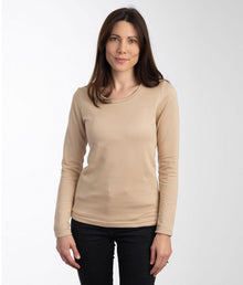  A woman wearing a beige long-sleeved EMF protective vest Leblok