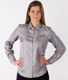  A woman wearing a long-sleeved grey EMF shirtfrom Leblok