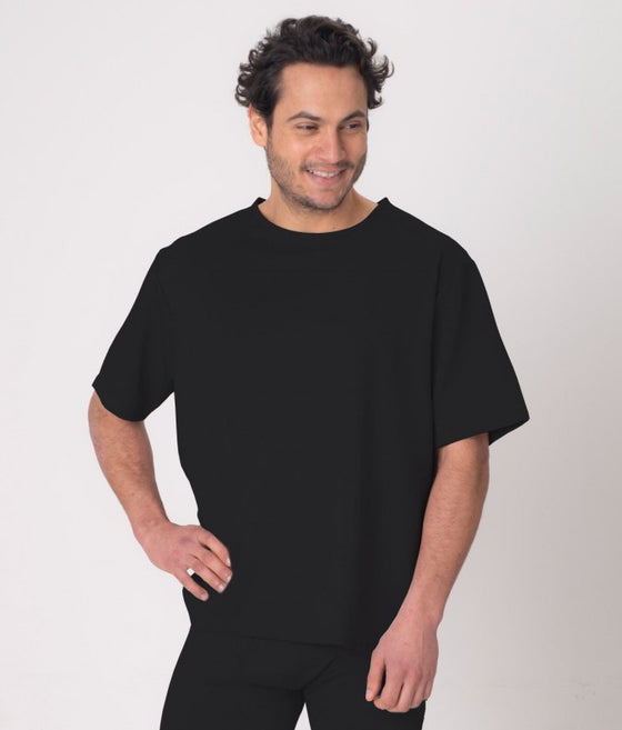 A man wearing a black EMF protective T-shirt Leblok