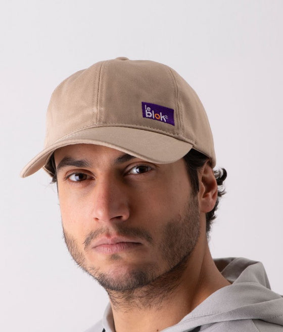 Beige EMF protective cap Leblok on a man