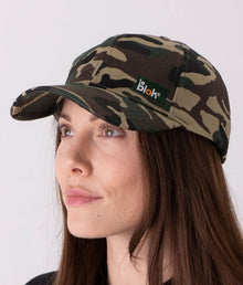  A woman wearing a camouflage EMF protective cap Leblok