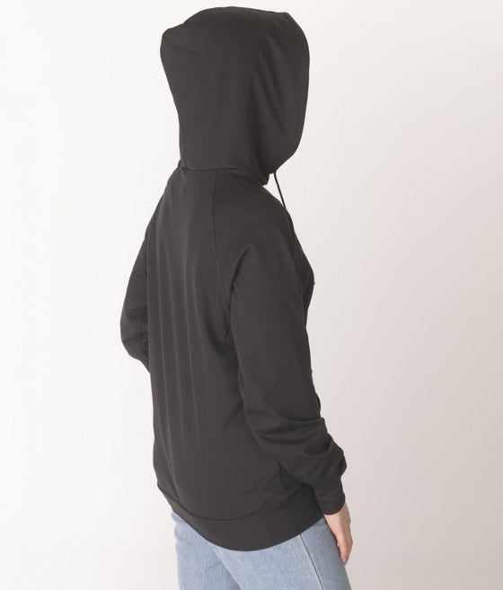 Leblok EMF hoodie on a model with hood on - side view