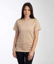  A woman wearing a beige Leblok EMF protective T-shirt