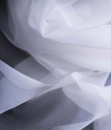  A close-up of white semi-transparent EMF reflective fabric Veil