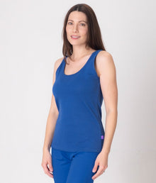  A woman wearing blue EMF protective vest and leggigs from Leblok